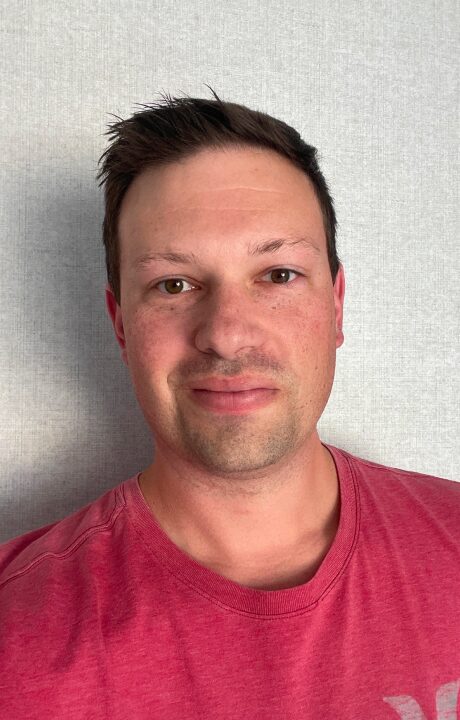 A headshot of Aaron Bauer