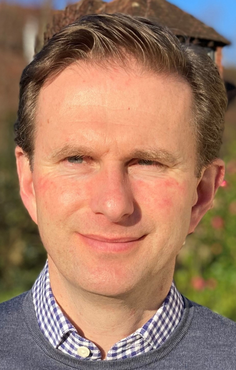 A headshot of Anthony Hills